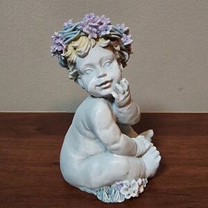 Baby garden statue with flower crown